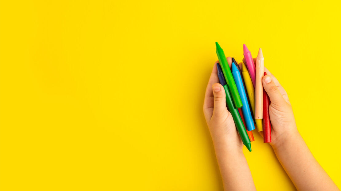 poze/top-view-little-kid-holding-colorful-pencils-yellow-surface.jpg